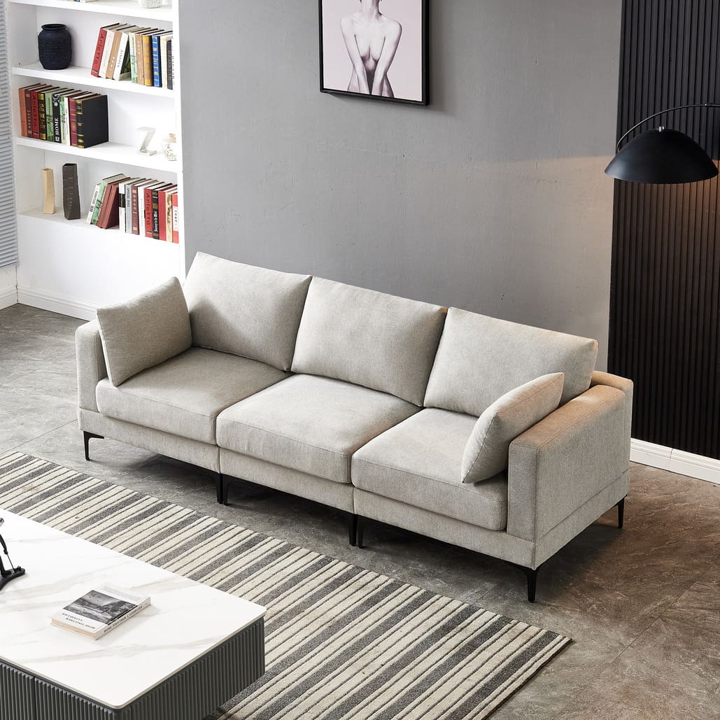 Anek three seater grey fabric sofa with plush cushions and modern design in contemporary living room setting
