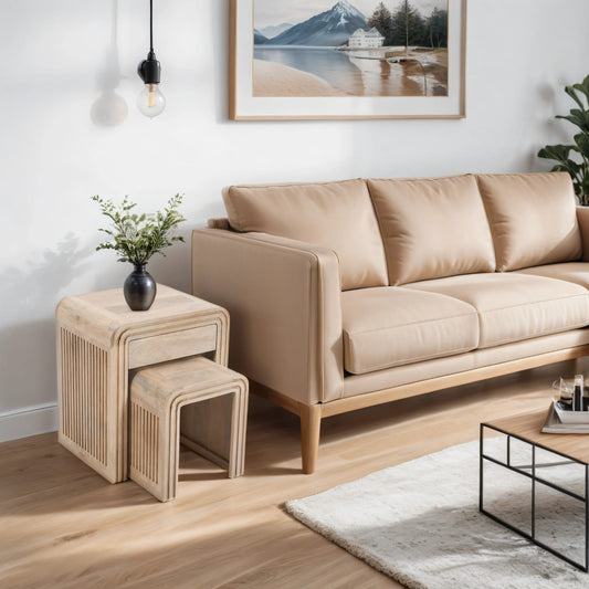 Hudson carved mango wood nest tables beside beige sofa, featuring modern design and drawer storage in natural finish