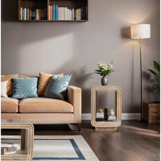 Hudson Carved Mango Wood Side Table styled in modern living room with beige sofa, blue pillows and floor lamp